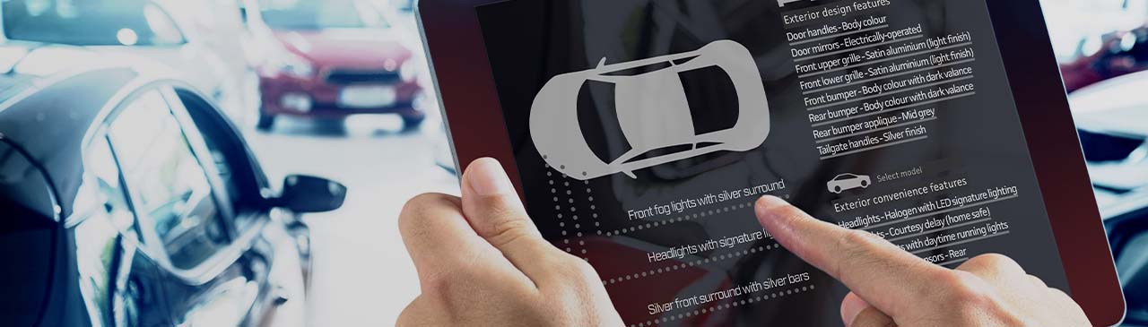 Man handing a car order on the tablet