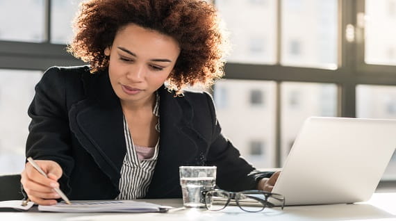 women sitting in front of a desk