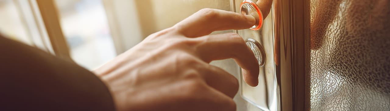 finger pressing lift button