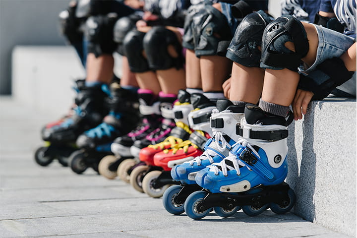 four people with inline skates